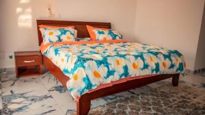 Un pat sau paturi într-o cameră la QPT