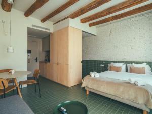 Postel nebo postele na pokoji v ubytování Boutique Apartments 23 Barcelona
