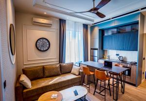 a living room with a couch and a table at Miha Premium Apartment 2BR 50m from Main Square in Belgrade +42 photos