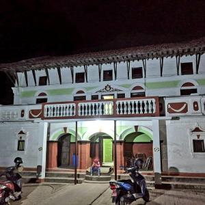 two motorcycles parked in front of a building at Durbar Restro Hotel & Party Venue in Pātan