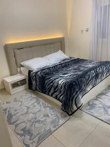 Postel nebo postele na pokoji v ubytování City Stars Apt2