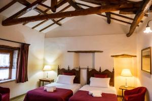 A bed or beds in a room at Corte Cristina & Suites