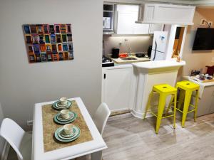 a small kitchen with a table with plates on it at Flat Champ's Elysées in Sao Paulo