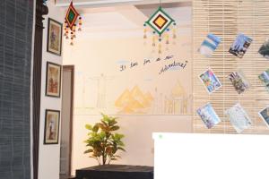 a room with a wall with kites on it at Elysium Inn in Hyderabad