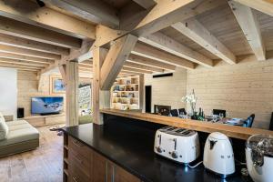 a kitchen with white appliances on a counter at Résidence Saint Joseph - Chalets pour 11 Personnes 294 in Val-d'Isère