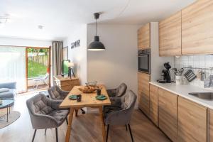 a kitchen and dining room with a table and chairs at Berglust in Bad Hindelang