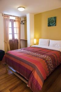 A bed or beds in a room at Kamma Guest House