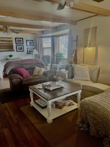 a living room with a couch and a coffee table at Country relaxation in Naches