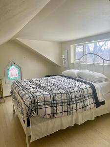 a bedroom with a bed in a attic at Country relaxation in Naches