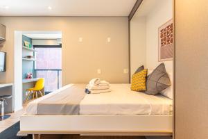 A bed or beds in a room at Easy Star - Studio Estiloso na Vila Olímpia - TS03G