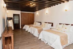 Postel nebo postele na pokoji v ubytování La Casona de Josefa
