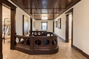 a room with a large bed in the middle of it at Duff Heritage House in St. John's