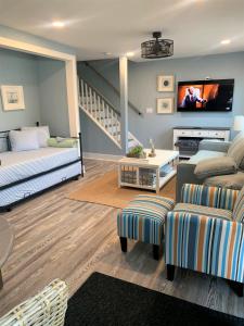 a living room with a couch and a tv at Two level, 2-Bedrm, 1 ½ Bathrm. in Seaside Heights