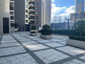 a courtyard in a city with tall buildings at Angel BW Apartments in Sajmište