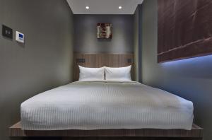 Ліжко або ліжка в номері Beauty Hotels Taipei - B7 Journey