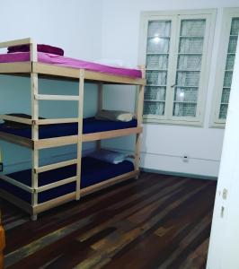 a bunk bed room with two bunk beds at Hostel Bahia in Porto Alegre