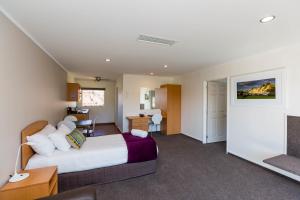 Postel nebo postele na pokoji v ubytování Aspen Court Motel Taihape