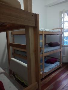 a group of bunk beds in a room at Hostel Bahia in Porto Alegre