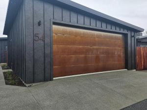 a garage door with the number on it at The Totara Bach in Twizel