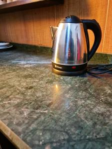 a tea kettle sitting on top of a counter at Happy vista pyramids inn in Cairo