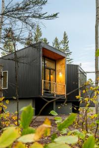 a modern house with a black exterior at Ski Hill Cabins and Saunas in Lutsen