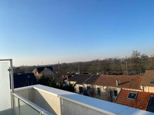 a view of a city from the roof of a building at Le 147 Parc Entre Paris et Disney in Champigny-sur-Marne