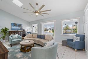 a living room with a couch and chairs at Collinson Ct Retreat | Palm Coast in Palm Coast