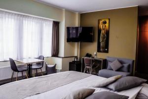 Postel nebo postele na pokoji v ubytování Hotel des Postes + 21 fotografií