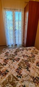 Postel nebo postele na pokoji v ubytování Apartmani Milicevic