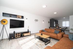 TV a/nebo společenská místnost v ubytování The Loft