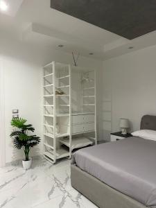 Ένα ή περισσότερα κρεβάτια σε δωμάτιο στο B&B IL PICCOLO PRINCIPE