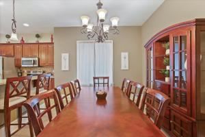 a kitchen and dining room with a table and chairs at Greenridge Getaway:Near Universities & Attractions in Scranton