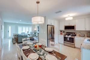 a kitchen and dining room with a table and chairs at Lush Punta Gorda Escape Private Pool and Lanai in Punta Gorda