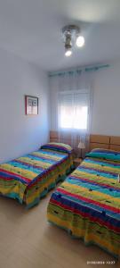 Postel nebo postele na pokoji v ubytování F4-Costa Marfil II World, Excepcional- SERVHOUSE