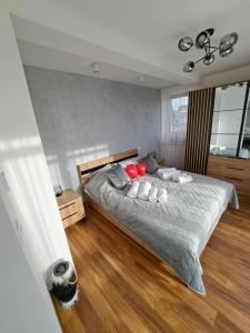 a bedroom with a bed with two pillows on it at Apartament Kluskowe Widoki in Kluszkowce