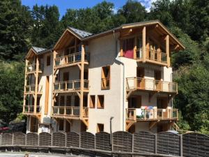 a house being built on the water at Chalet Des Domaines De La Vanoise - Confortable appartement au calme, à 1km du village et 5 km de la station MAE-3134 in Peisey-Nancroix