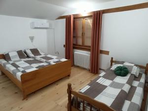 Postel nebo postele na pokoji v ubytování Villa Ema