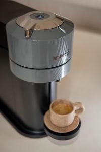 a coffee maker with a cup of coffee at Nãmas Tulum in Tulum