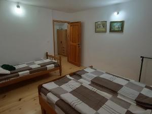 Postel nebo postele na pokoji v ubytování Villa Ema