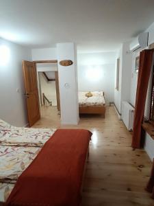 Postel nebo postele na pokoji v ubytování Villa Ema