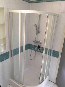a shower with a glass door in a bathroom at Appartement d'une chambre a Le Havre a 850 m de la plage in Le Havre