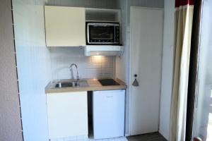 Η κουζίνα ή μικρή κουζίνα στο Résidence Cristal - Cristal 161 MAE-5824 +6 φωτογραφίες