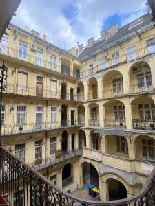 a large building with balconies on the side of it at Malvin Apartman in Budapest