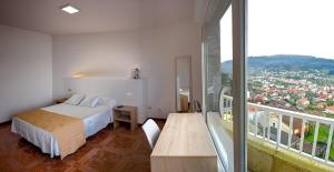 Postel nebo postele na pokoji v ubytování Apartamentos Costas de Bueu B