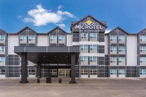 a rendering of the exterior of a hotel at Microtel Inn & Suites by Wyndham Whitecourt in Whitecourt