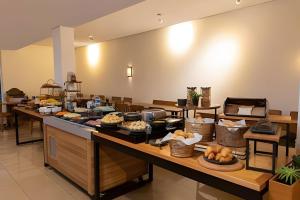 a buffet line with many different types of food at Paulista Premium Flat in Sao Paulo