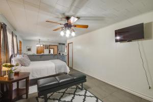 a bedroom with a bed and a ceiling fan at Silver Creek Getaway with Fireplace - 12 Mi to Lake in Prentiss