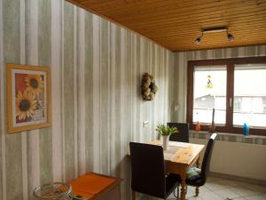a dining room with a table and a window at Apartment in Werratal with terrace in Großalmerode