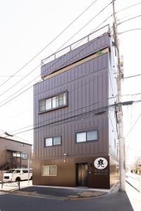 a building with a sign on the side of it at Light Hotel - Vacation STAY 91078v in Tokyo
