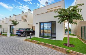a house with a car parked in front of it at 3 Bedroom Amazing Home In Torre Pacheco in Torre-Pacheco +45 photos
